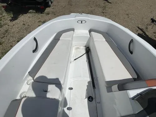 Slide: The Image of 2019 Tahoe T16 boat interior with white seating and storage compartments. - 9