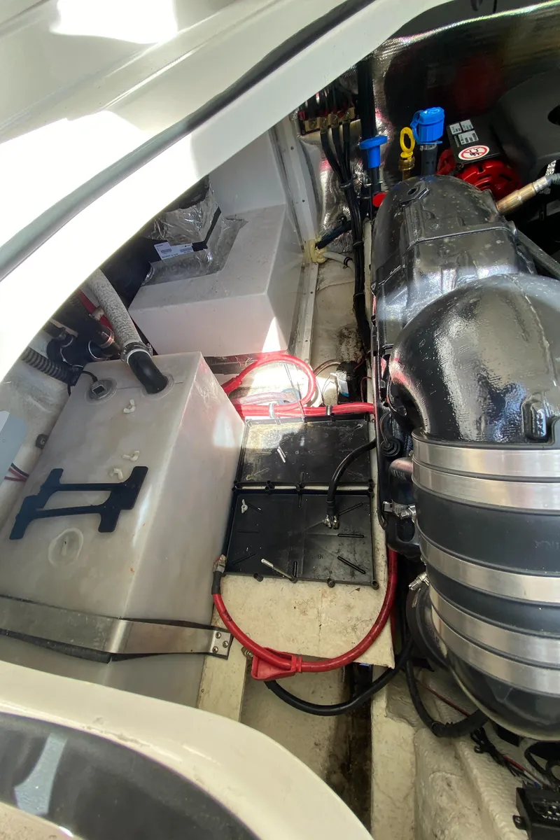 Slide: The Image of 2018 Regal 28 Express engine compartment with visible components and wiring. - 13