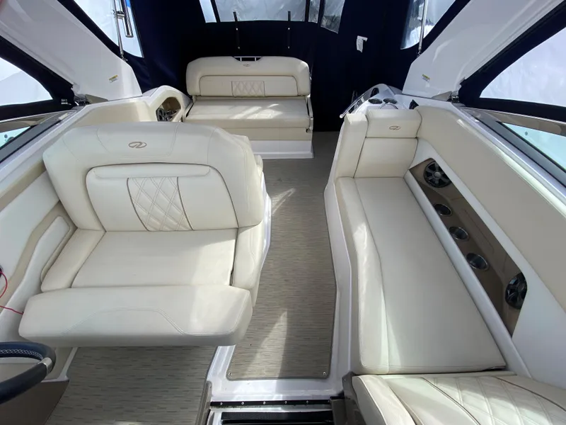 Slide: The Image of 2018 Regal 28 Express boat interior with white leather seating and modern design. - 8