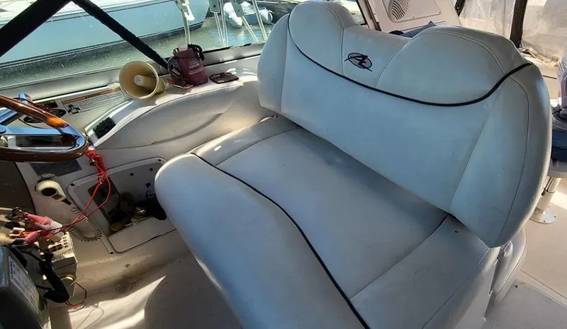 Slide: The Image of 1999 Bayliner 4085 Avanti boat interior with white leather seating. - 10