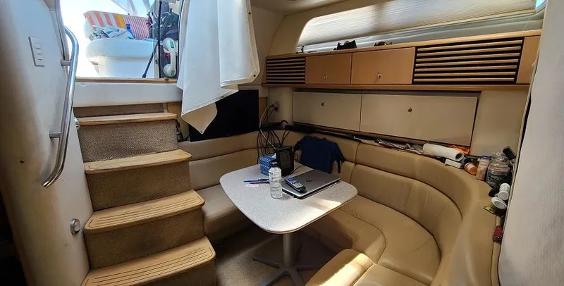 Slide: The Image of 1999 Bayliner 4085 Avanti interior with seating area and stairs. - 19