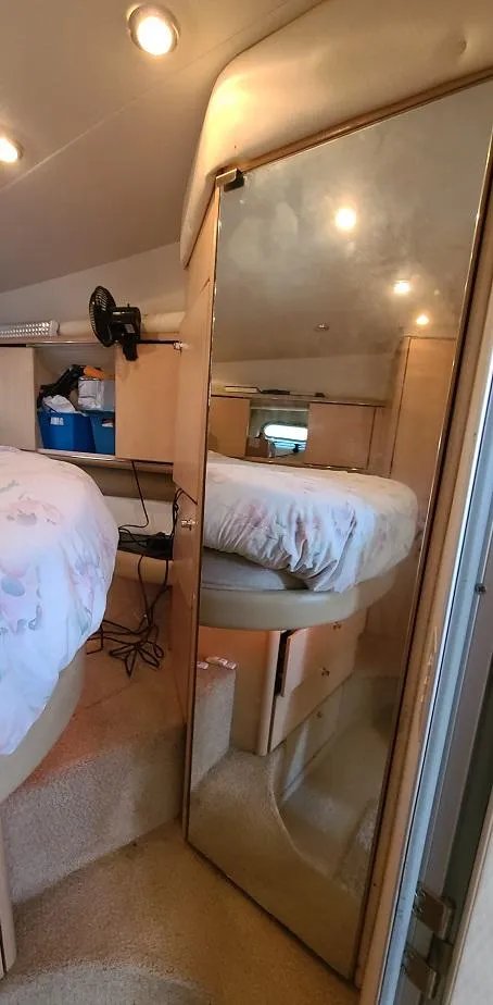 Slide: The Image of Interior cabin of a 1999 Bayliner 4085 Avanti yacht with mirrored door. - 29