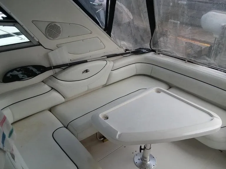 Slide: The Image of 1999 Bayliner 4085 Avanti interior seating area with table. - 6