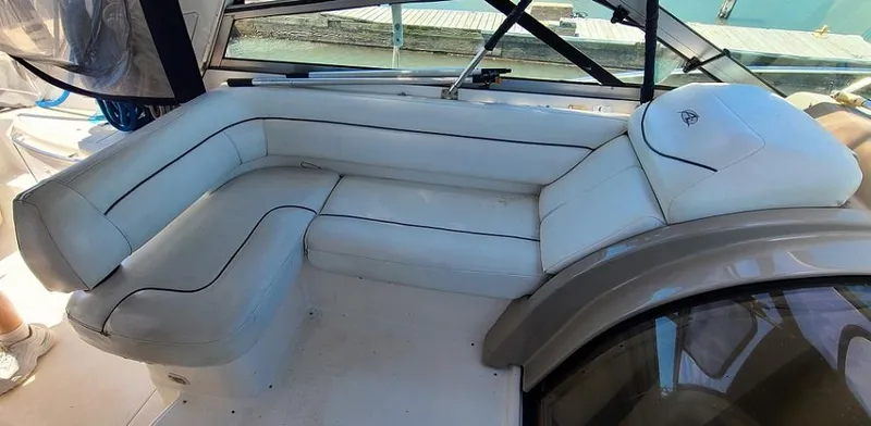 Slide: The Image of 1999 Bayliner 4085 Avanti boat interior with white leather seating. - 9