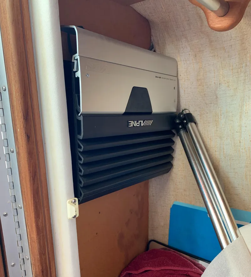Slide: The Image of Alpine amplifier installed in a 1991 Sea Ray 290 Sundancer cabin. - 18