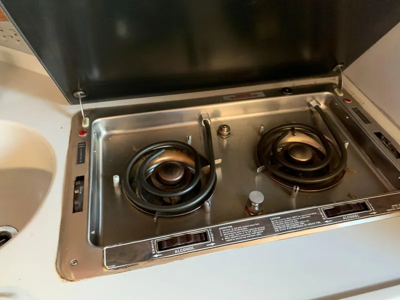 Slide: The Image of 1991 Sea Ray 290 Sundancer stove with two burners and alcohol fuel option. - 19