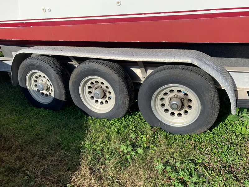 Slide: The Image of Trailer with three wheels for 1991 Sea Ray 290 Sundancer boat. - 30