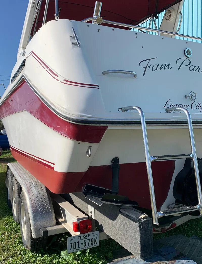 Slide: The Image of 1991 Sea Ray 290 Sundancer boat on trailer, red and white design, League City, Texas. - 33