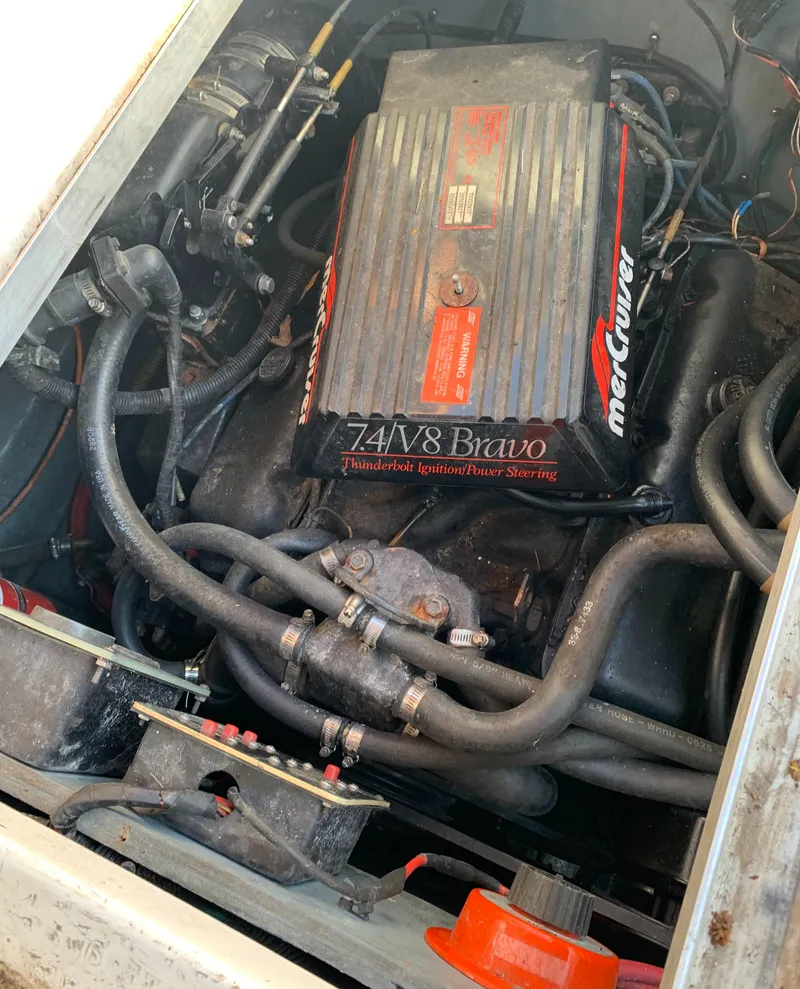 Slide: The Image of 1991 Sea Ray 290 Sundancer engine compartment with MerCruiser 7.4L V8 Bravo motor. - 36