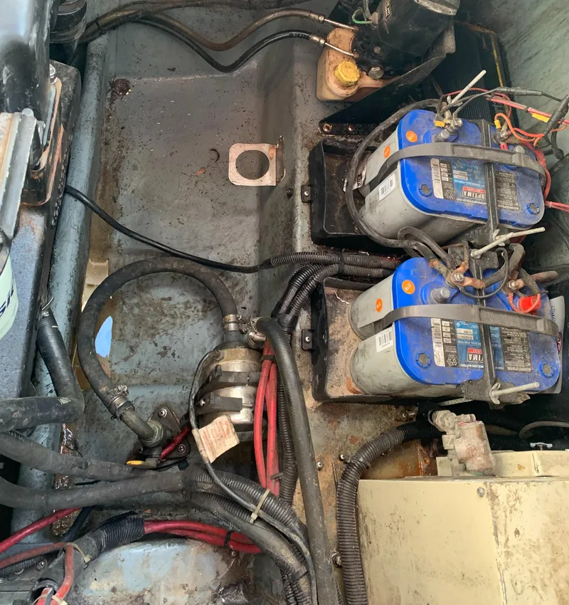 Slide: The Image of Engine compartment of a 1991 Sea Ray 290 Sundancer with visible batteries and wiring. - 38