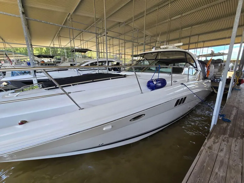 Slide: The Image of 2008 Sea Ray 44 Sundancer yacht docked in a covered marina. - 3