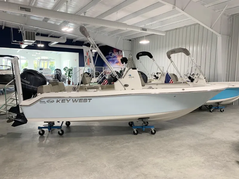 Slide: The Image of 2024 Key West 189 FS boat displayed in a showroom. - 0