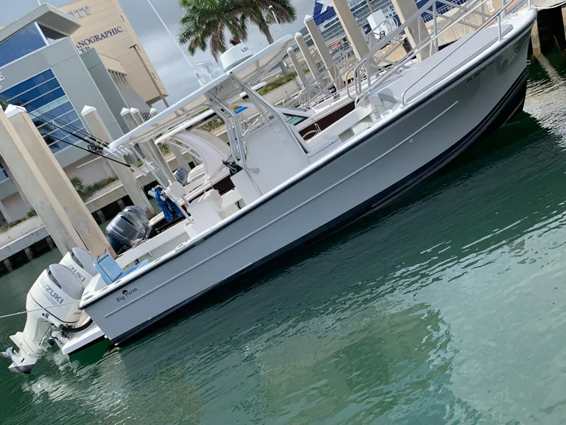 Slide: The Image of 2011 Dusky 28xl boat docked at a marina. - 1