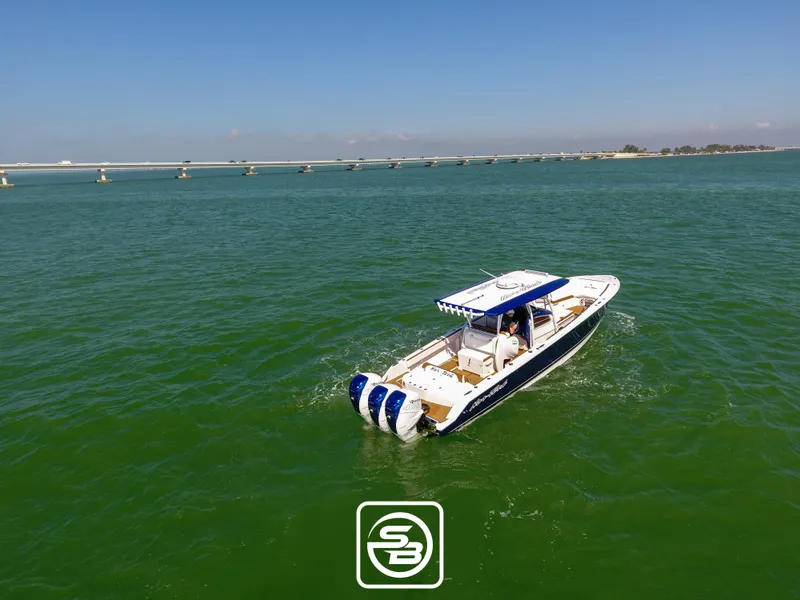 Slide: The Image of 2021 Nor-Tech 390 Sport boat cruising on open water. - 11
