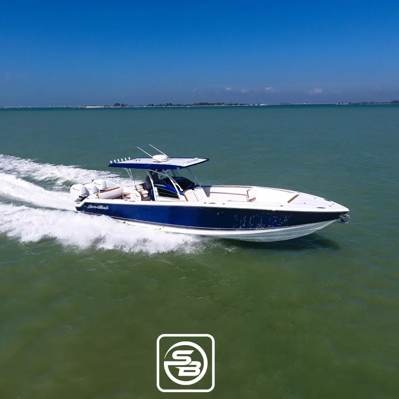 Slide: The Image of 2021 Nor-Tech 390 Sport boat cruising on open water. - 27