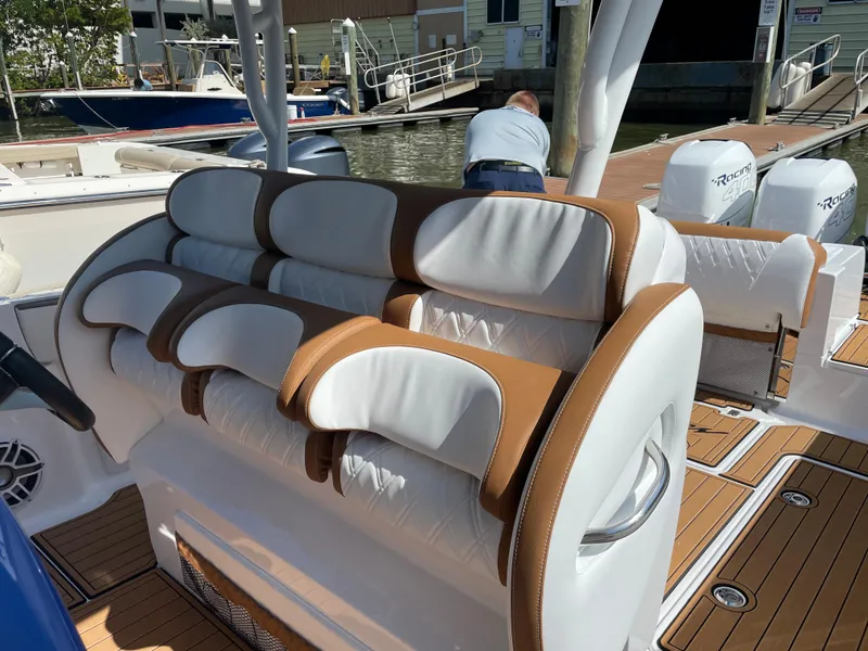 Slide: The Image of 2021 Nor-Tech 390 Sport boat with luxurious seating at the dock. - 28