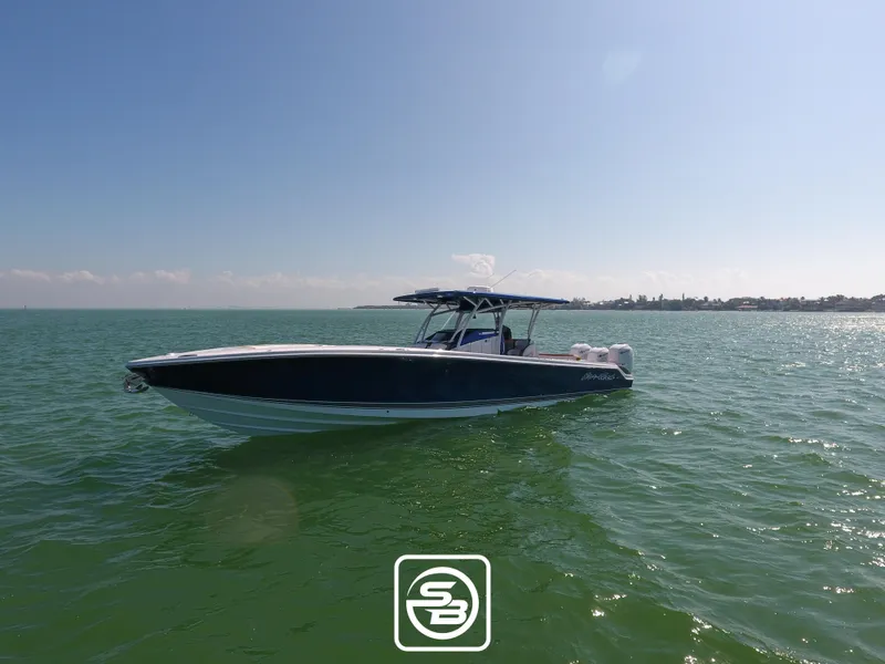 Slide: The Image of 2021 Nor-Tech 390 Sport boat on open water. - 4