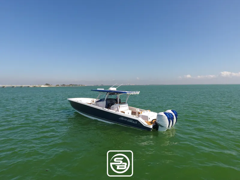 Slide: The Image of 2021 Nor-Tech 390 Sport boat on open water. - 6