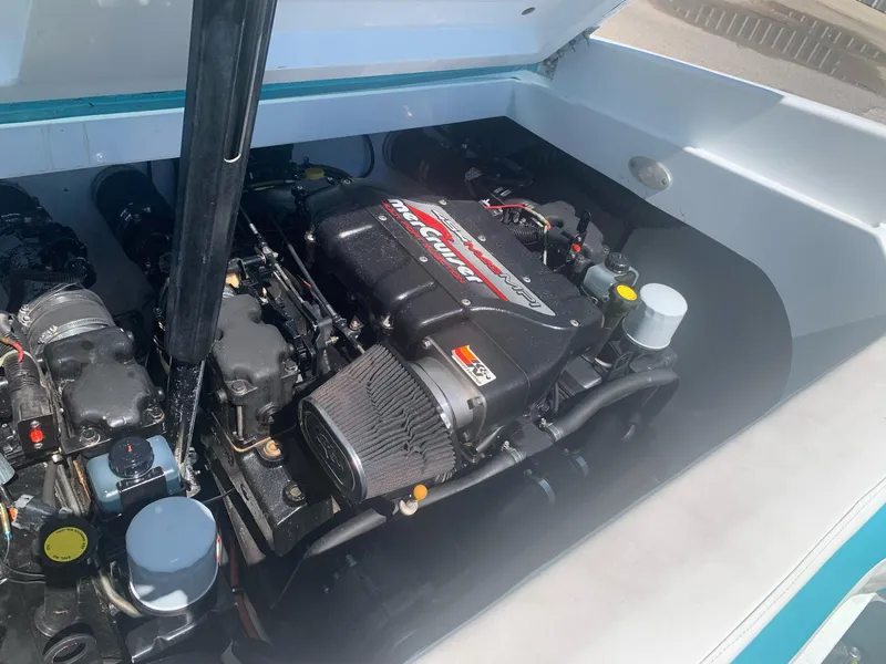 Slide: The Image of 1999 Baja 29 Outlaw SST engine compartment with MerCruiser engine. - 21