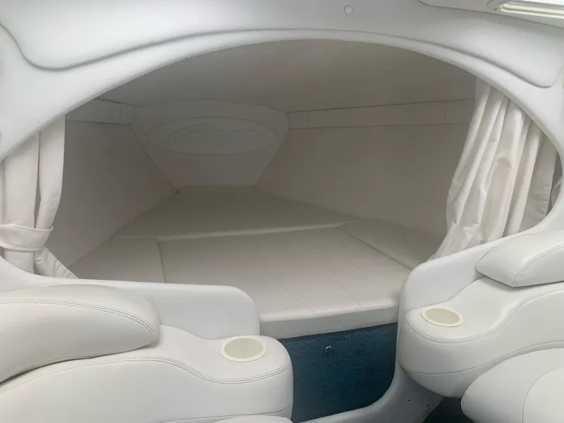 Slide: The Image of Interior cabin of a 1999 Baja 29 Outlaw SST boat with white upholstery. - 24
