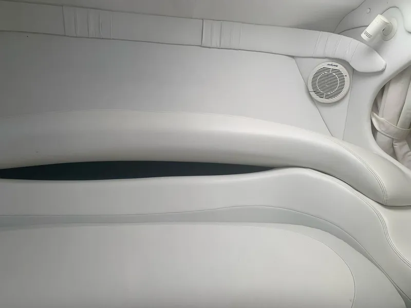 Slide: The Image of Interior seating of 1999 Baja 29 Outlaw SST boat with white upholstery. - 27