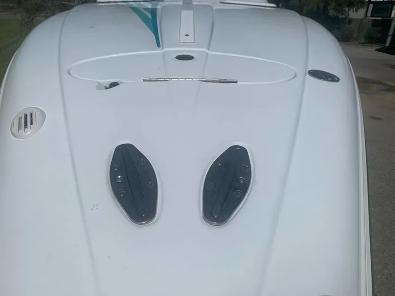 Slide: The Image of 1999 Baja 29 Outlaw SST boat deck with hatches and vents. - 34