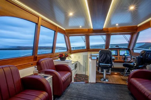 Slide: The Image of Luxurious interior of 2027 C.W. Hood 57 LM yacht with leather seating and modern helm. - 13