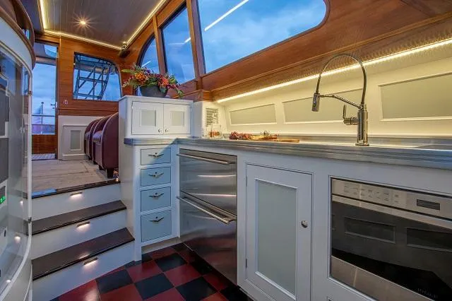 Slide: The Image of Luxurious interior of 2027 C.W. Hood 57 LM yacht with modern kitchen design. - 14