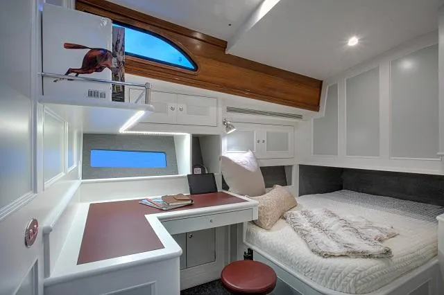 Slide: The Image of Luxurious cabin interior of 2027 C.W. Hood 57 LM yacht with bed and desk. - 15