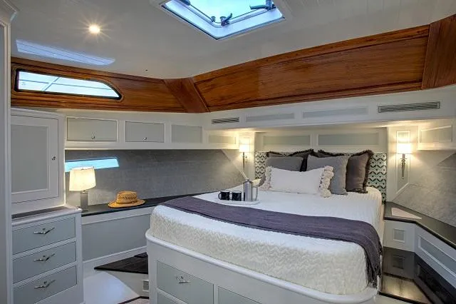 Slide: The Image of Luxurious cabin interior of 2027 C.W. Hood 57 LM yacht with elegant wood accents. - 16