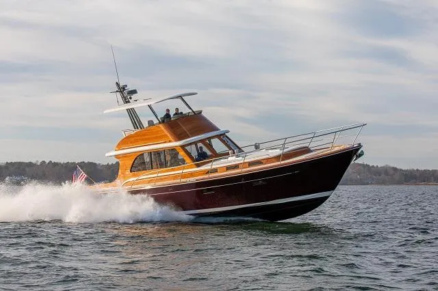 Slide: The Image of C.W. Hood 57 LM yacht cruising on water, 2027 model, elegant design. - 4