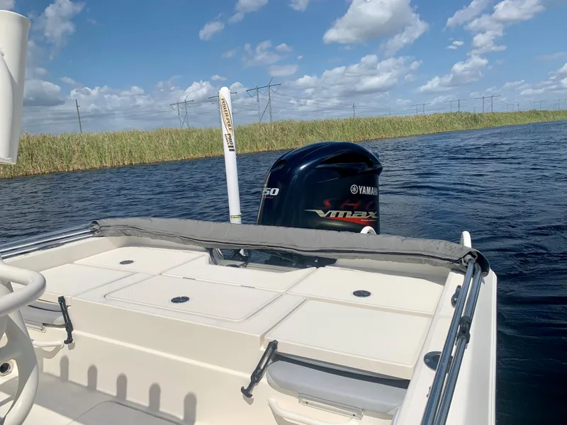 Slide: The Image of 2016 Skeeter SX230 boat with Yamaha VMAX engine on a calm waterway. - 12