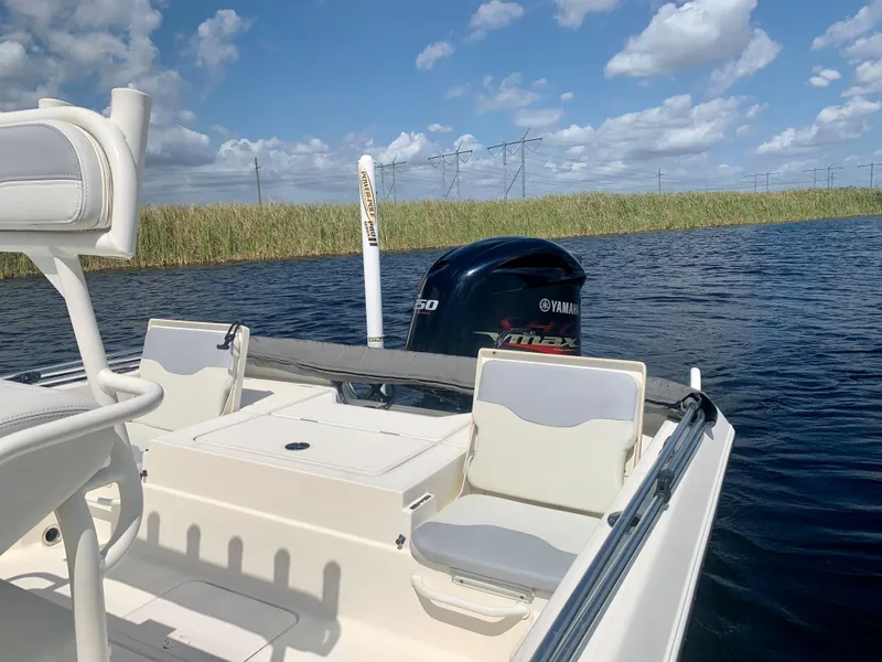 Slide: The Image of 2016 Skeeter SX230 boat with Yamaha engine on calm water. - 13