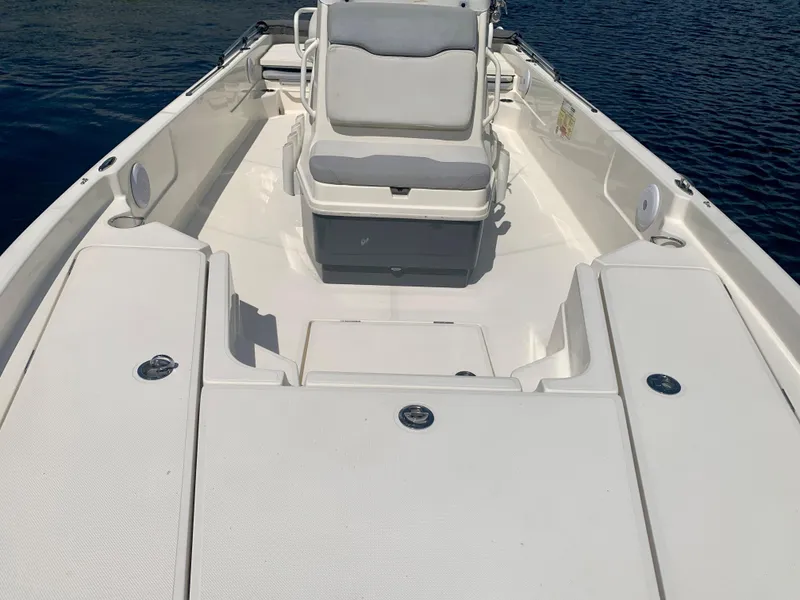 Slide: The Image of 2016 Skeeter SX230 boat interior with seating and storage compartments. - 14