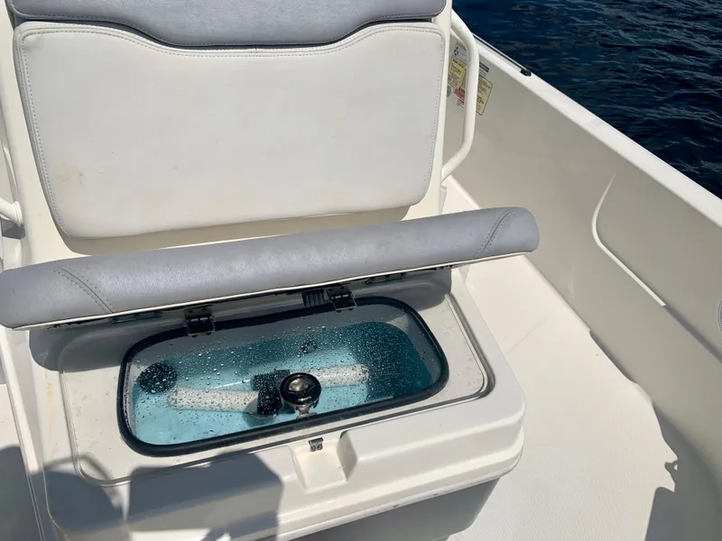 Slide: The Image of 2016 Skeeter SX230 boat with open livewell on deck. - 23