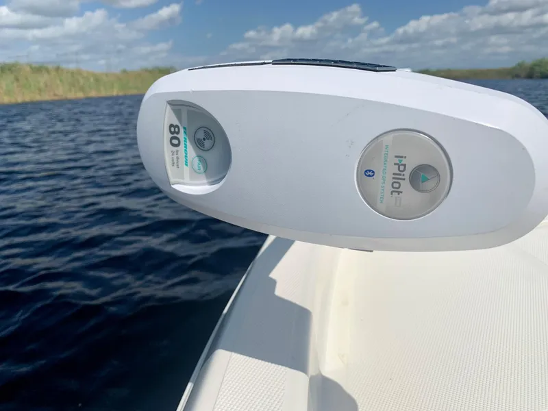 Slide: The Image of Close-up of a 2016 Skeeter SX230 boat with i-Pilot system on a sunny day. - 24