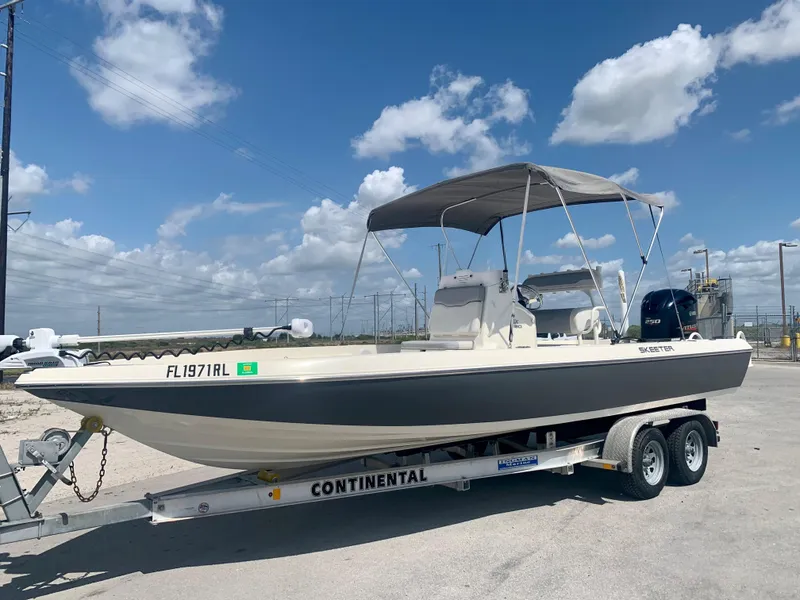 Slide: The Image of 2016 Skeeter SX230 boat on Continental trailer under blue sky. - 8
