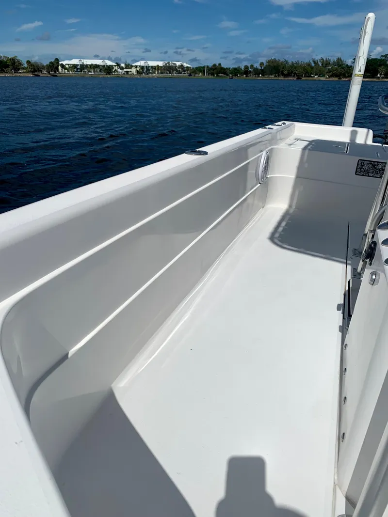 Slide: The Image of 2005 ShearWater z2400 boat on calm water, clear sky in the background. - 14