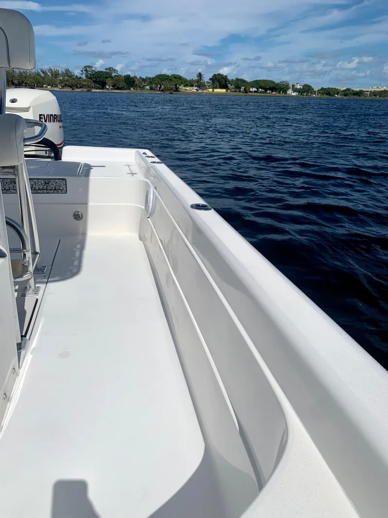 Slide: The Image of 2005 ShearWater z2400 boat on calm water with clear skies. - 15