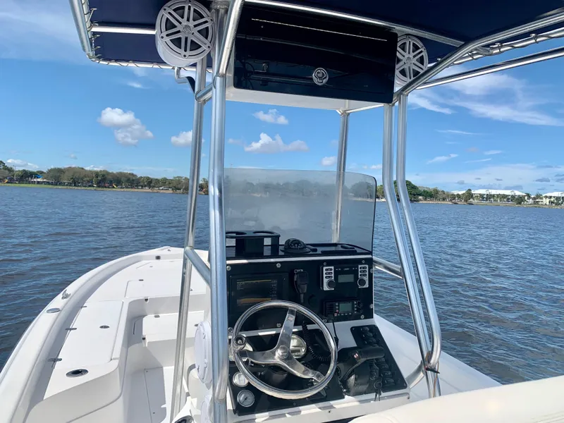 Slide: The Image of 2005 ShearWater z2400 boat console on a sunny day. - 21