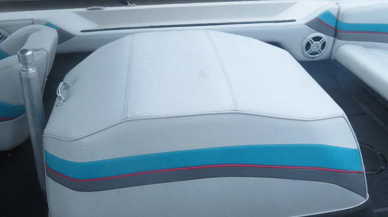 Slide: The Image of 1990 Nautique Ski boat interior with white, blue, and gray upholstery. - 5
