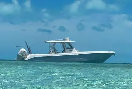 The Image of 2019 Everglades 365 boat on clear turquoise water under a blue sky. - 0