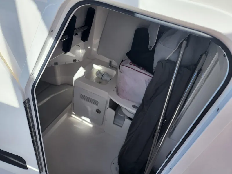 Slide: The Image of 2019 Everglades 365 boat interior cabin with storage and seating. - 19