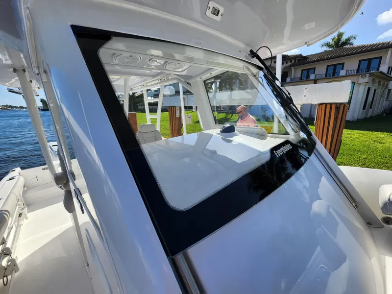 Slide: The Image of 2019 Everglades 365 boat docked near waterfront property. - 20