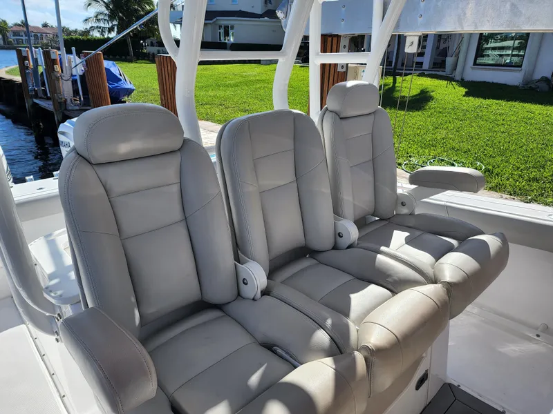 Slide: The Image of 2019 Everglades 365 boat with three cushioned seats in the cockpit area. - 24