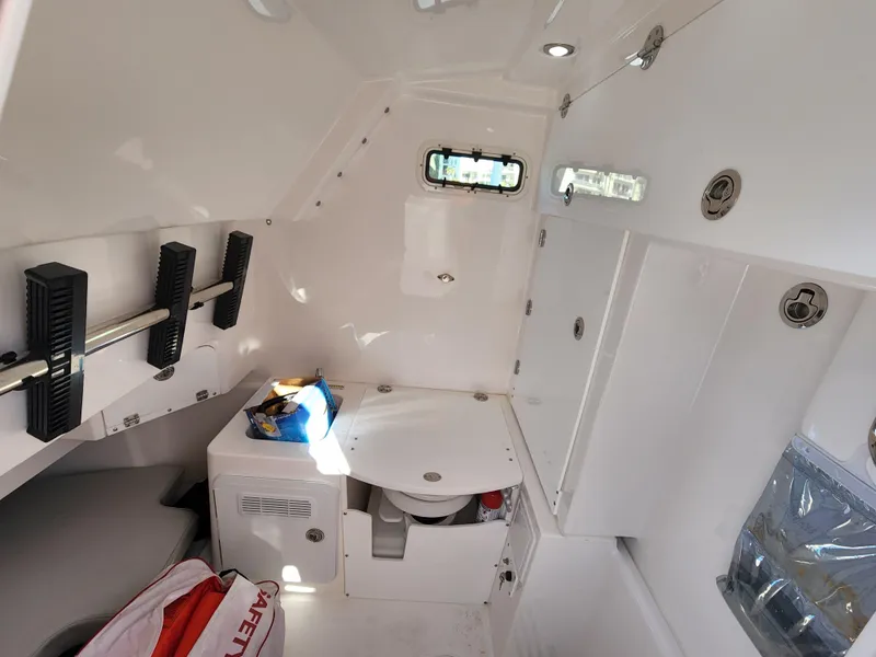 Slide: The Image of Interior cabin of 2019 Everglades 365 boat with storage and seating. - 26