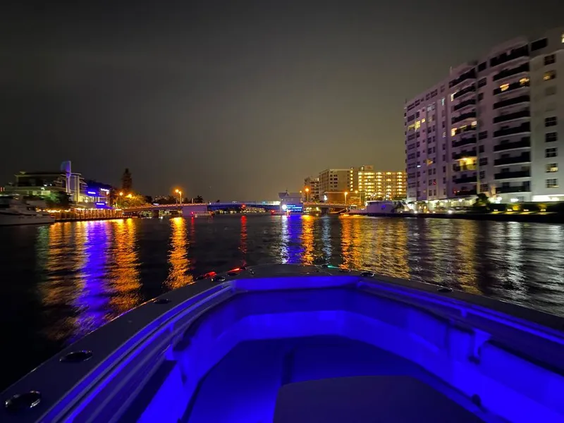 Slide: The Image of Night view from Everglades 365 boat, city lights reflecting on water, 2019. - 28