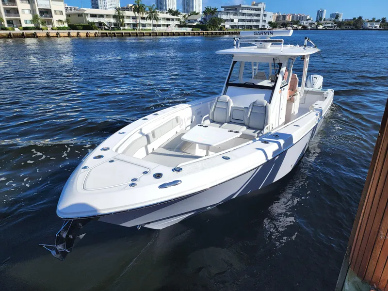 Slide: The Image of 2019 Everglades 365 boat docked on a sunny day. - 7
