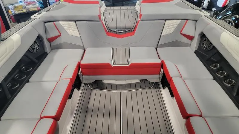Slide: The Image of Interior of 2022 Nautique Super Air Nautique S23 with red and gray seating. - 10
