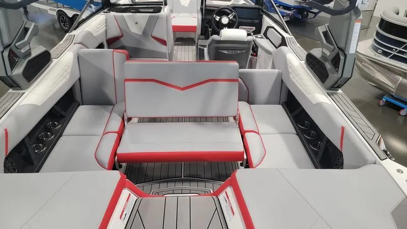 Slide: The Image of 2022 Nautique Super Air Nautique S23 interior with gray and red seating, modern design. - 6